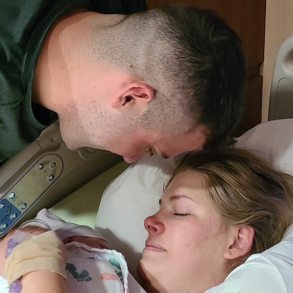 woman holding newborn baby